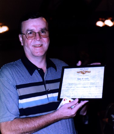 Jim Lavelle proudly holding his certificate